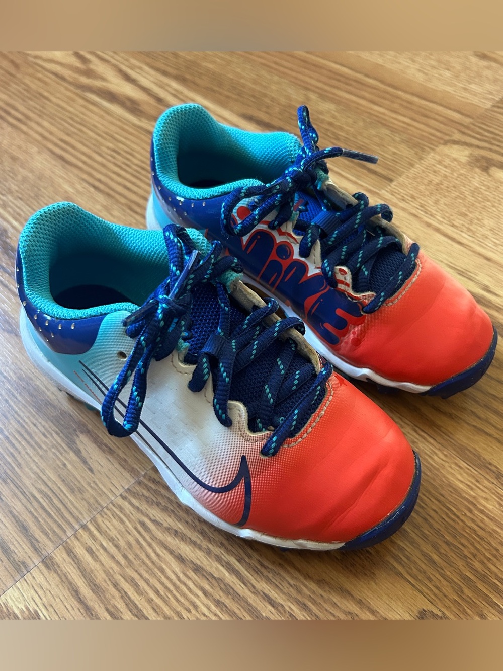Nike red white and blue cleats
